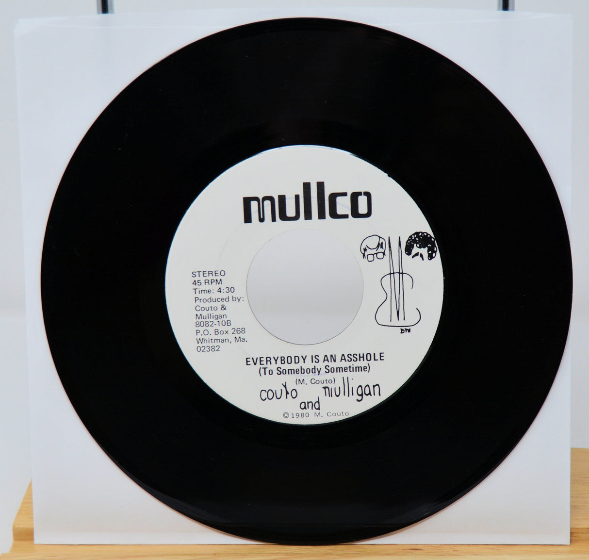 Vinyl record with a colorful album cover on a white background