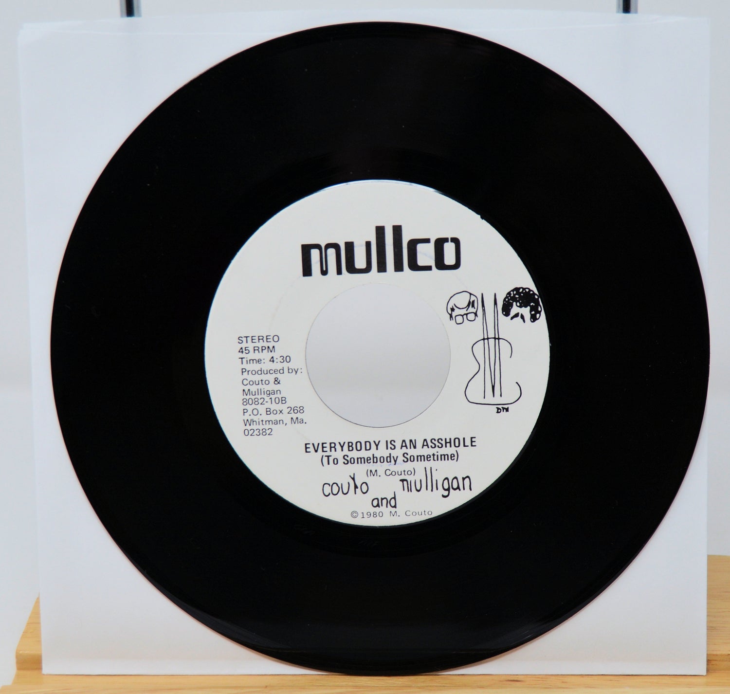 Vinyl record with a colorful album cover on a white background