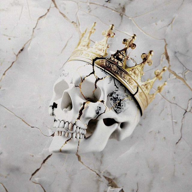 Cracked white skull adorned with an ornate gold crown on a marbled background