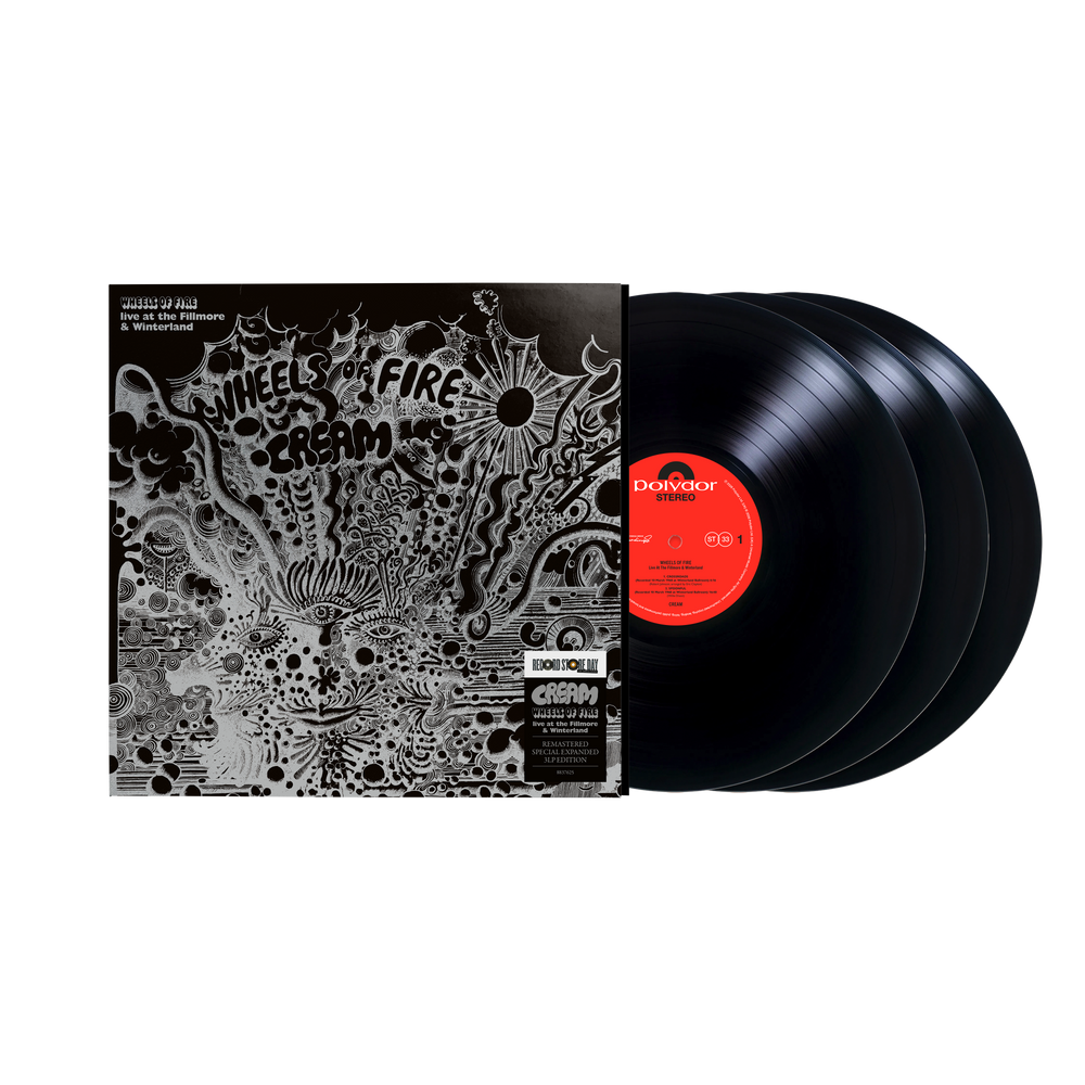 Three black vinyl records with a decorative cover on a white background