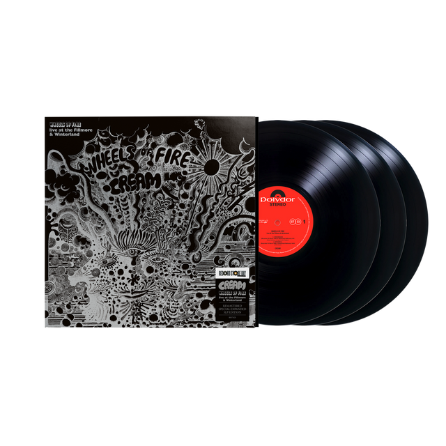 Three black vinyl records with a decorative cover on a white background