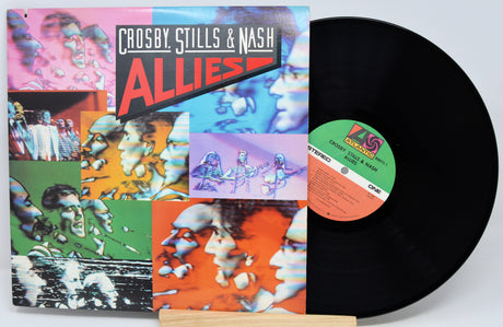 Vinyl record with colorful cover featuring 'Crosby, Stills & Nash' and 'Allies' on a white background