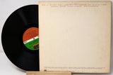 Vinyl record with a colorful label and its cover on a light background