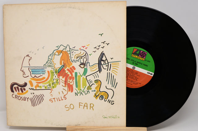 Vinyl record with colorful cover featuring artwork and text