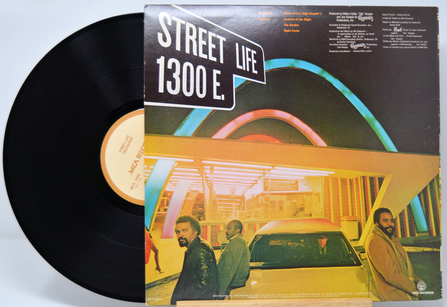 Vinyl record 'Crusaders Street Life' with cover featuring a cityscape and people, titled 'Street Life 1300 E.'