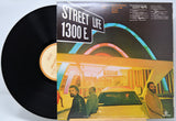 Vinyl record 'Crusaders Street Life' with cover featuring a cityscape and people, titled 'Street Life 1300 E.'