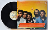 Vinyl record with a cover featuring a group of five men.