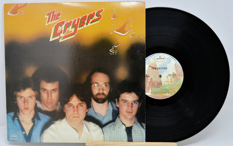 Vinyl record with cover featuring a group of people and album details.