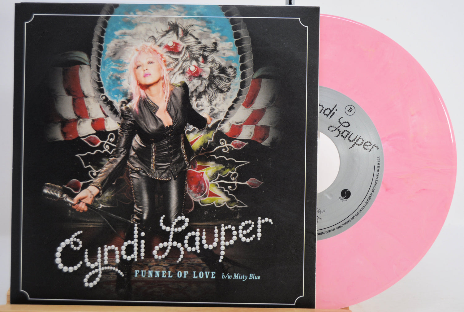Vinyl record 'Funnel of Love' with a cover featuring Cyndi Lauper and a pink disc.