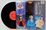 Vinyl record with colorful cover featuring a person in various poses