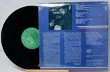 Vinyl record with blue cover featuring a person and text