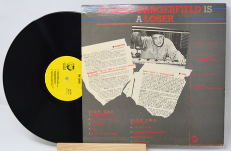 Vinyl record with its cover featuring a humorous title and text.