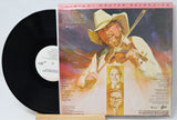 Vinyl record with cover featuring a person playing violin, on a light gray background