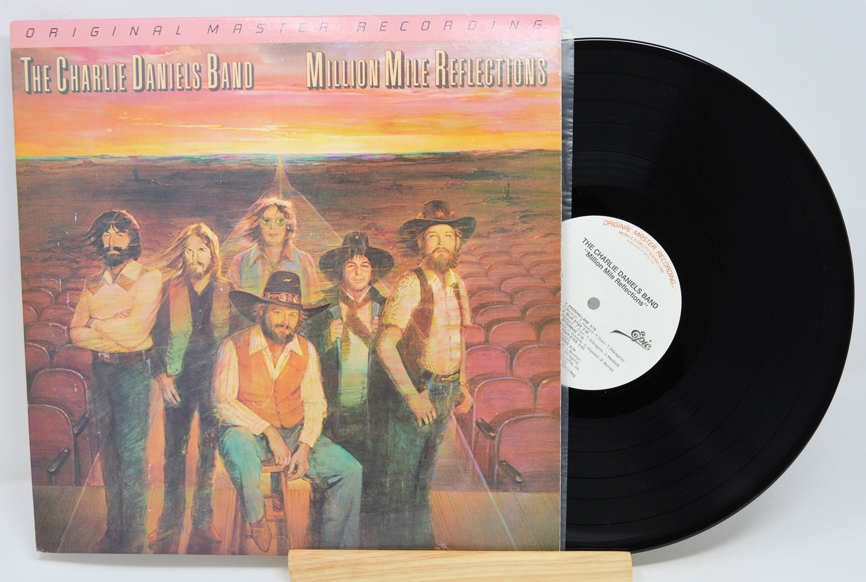 Vinyl record with cover featuring The Charlie Daniels Band and 'Million Mile Reflections' text.