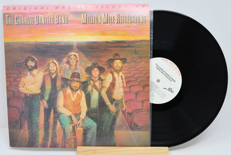 Vinyl record with cover featuring The Charlie Daniels Band and 'Million Mile Reflections' text.