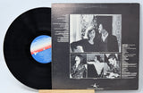 Vinyl record by Daring & Stahl called ' Sweet Melodies In The Night' with a back cover featuring pictures of the band along with song titles and credits in text.