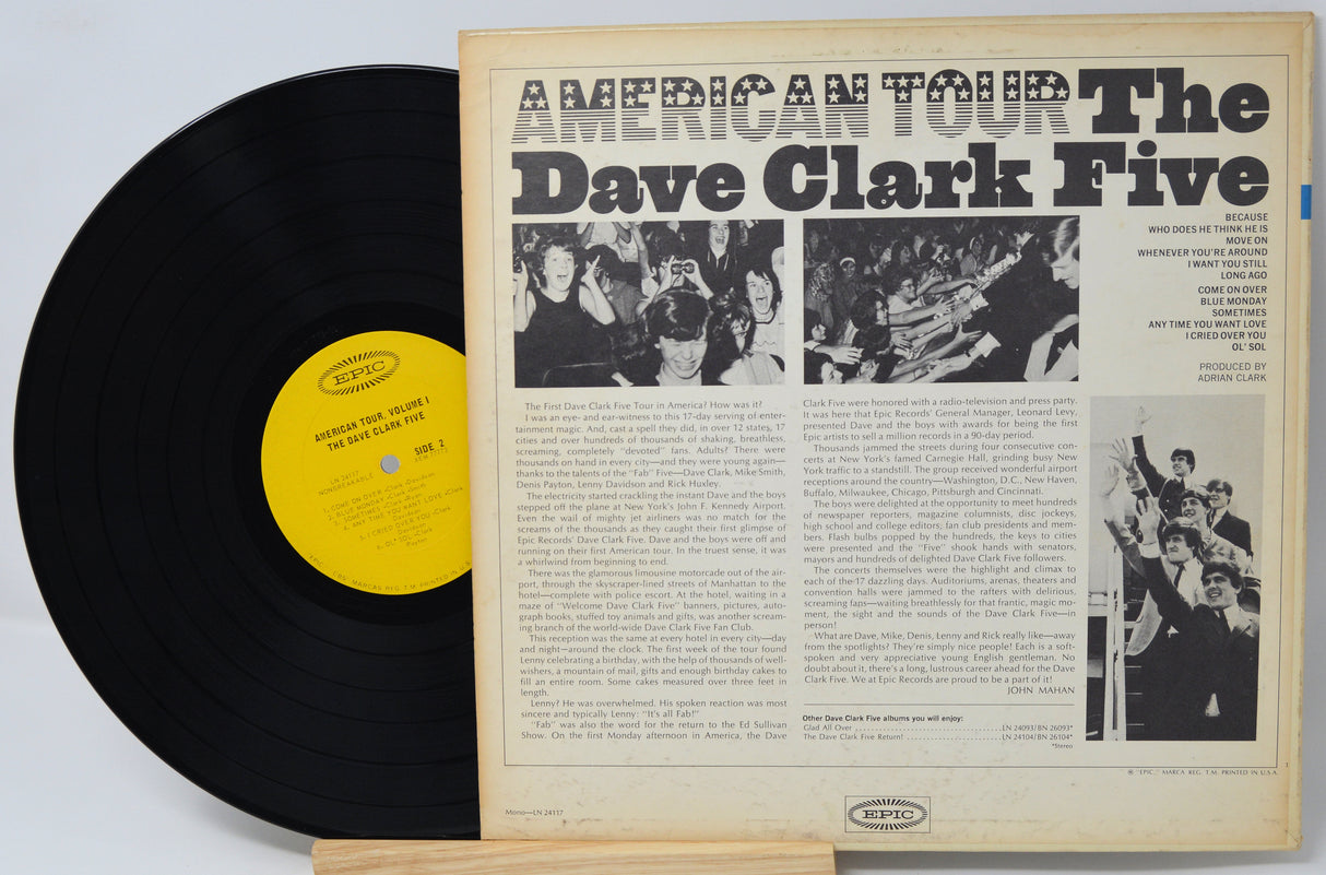 Vinyl record with a yellow label and cover featuring black and white images and text.