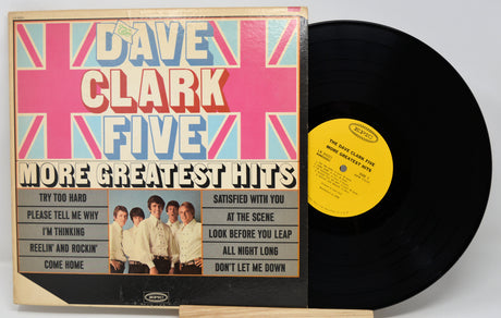 Vinyl record and cover with 'Dave Clark Five' on a white background