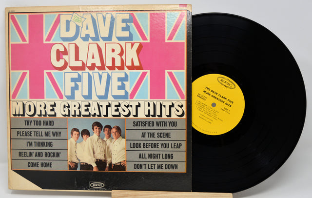 Vinyl record and cover with 'Dave Clark Five' on a white background