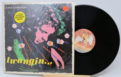 Vinyl record with cover featuring colorful artwork and text