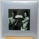 Dave Matthews Band 'Recently' vinyl record album cover, sealed in plastic shrink wrap and displayed on a wooden stand against a light gray background.