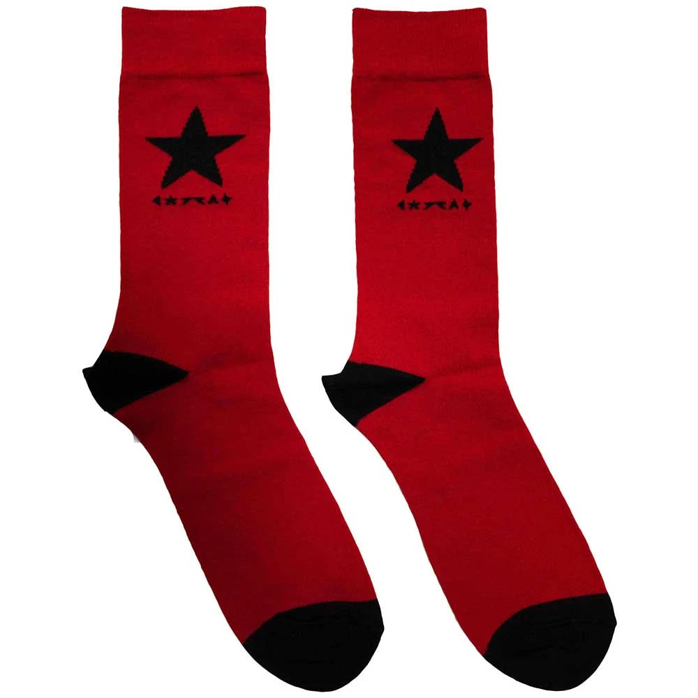 Red socks with black stars and cuffs on a white background