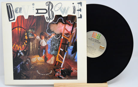 Vinyl record with cover featuring a child and dog in a room, EMI label visible