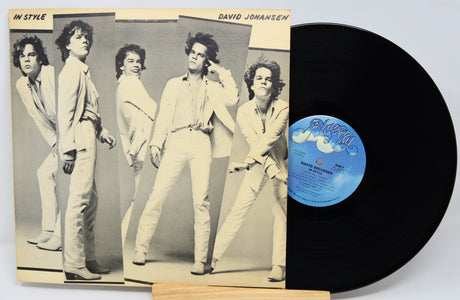 Vinyl record with a cover featuring a group of people posing.