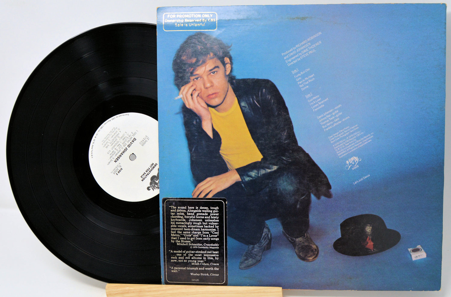 Vinyl record with a blue cover featuring a person and text