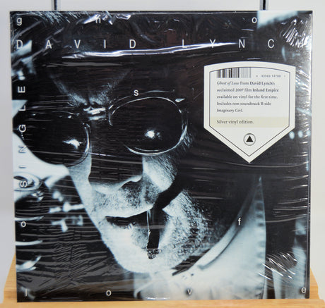 Vinyl record cover with black and white portrait and text, featuring the name 'David Lynch'.