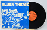 Vinyl record with blue cover featuring band members and 'Blues Theme' text.