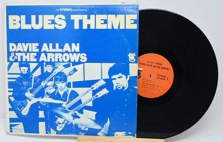 Vinyl record with blue cover featuring band members and 'Blues Theme' text.