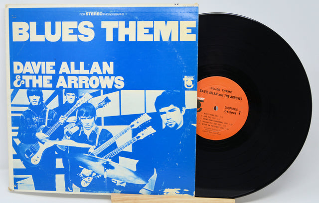 Vinyl record with blue cover featuring band members and 'Blues Theme' text.