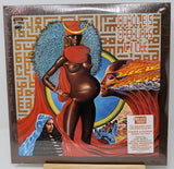 Vinyl record cover with artistic design of a figure and text, featuring vibrant colors.