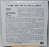 The back cover of a vinyl record sleeve for 'Steamin' With The Miles Davis Quintet' on Prestige 7200, featuring track listings and a barcode.
