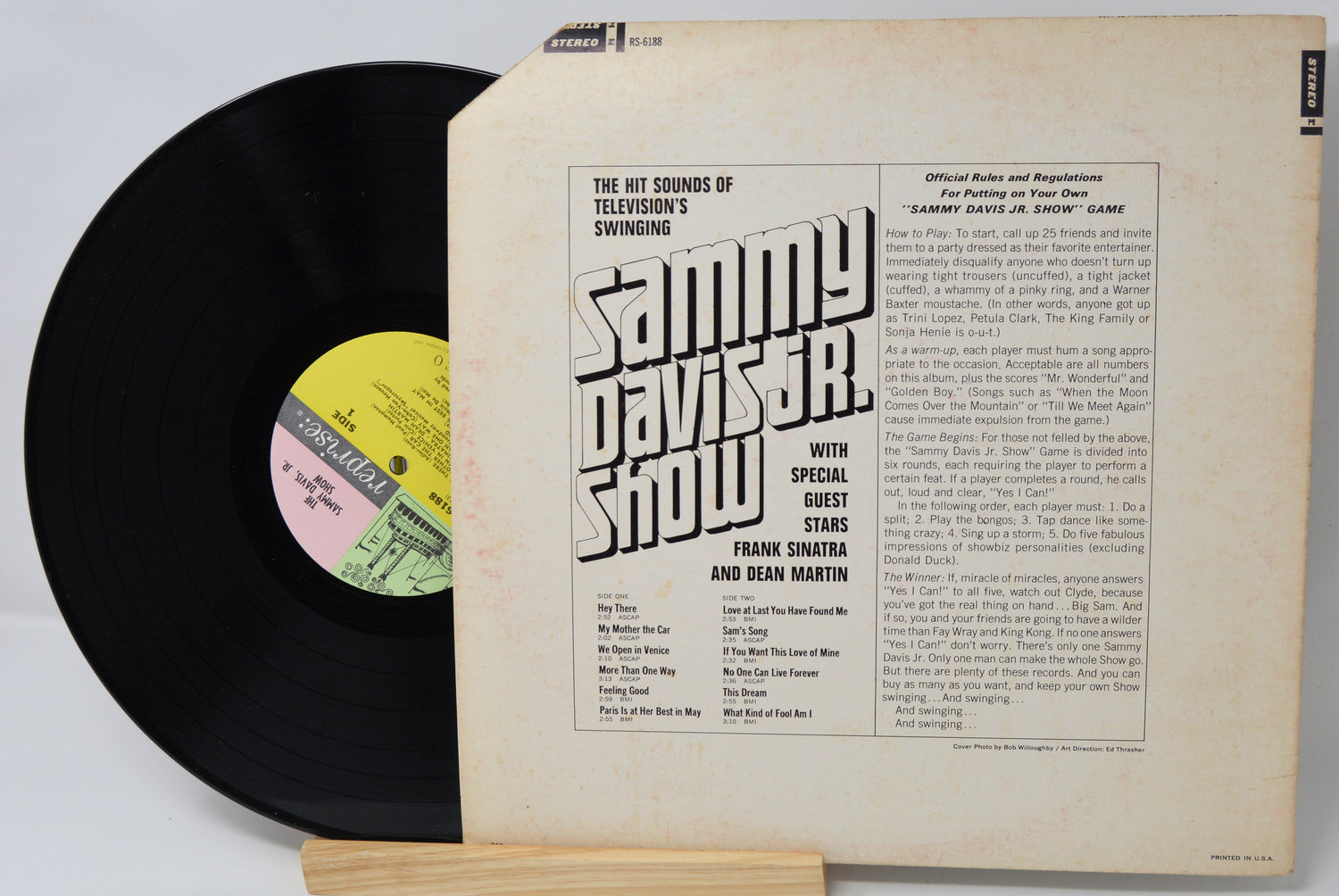 Vinyl record with cover featuring text and a yellow label