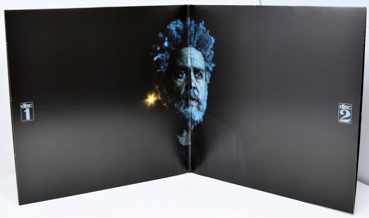 Open Dawn FM gatefold vinyl with elderly portrait of The Weeknd and disc markers