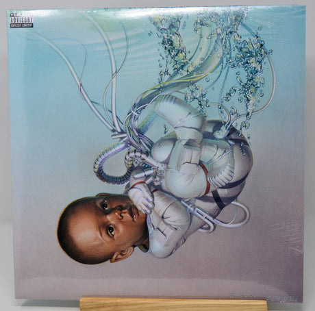 Futuristic artwork of a baby in a spacesuit surrounded by tubes from The Weeknd's Dawn FM vinyl