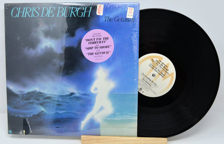 Vinyl record with cover featuring a person on a beach and 'Chris de Burgh' text.