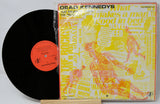 Vinyl record and cover of 'What Makes a Man Good in Bed' by Dead Kennedys on a white background