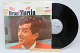 Vinyl record with cover featuring a portrait of Dean Martin on a white background