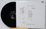 Vinyl record with cover featuring 'Death Grips' and 'The Money Store' on a white background
