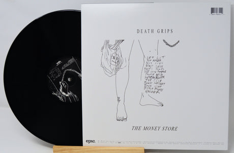 Vinyl record with cover featuring 'Death Grips' and 'The Money Store' on a white background