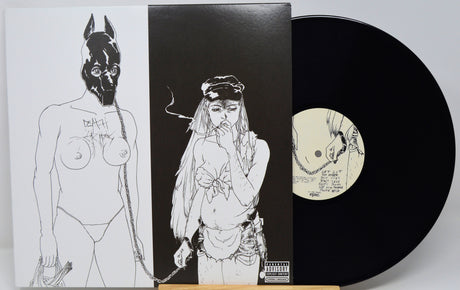 Vinyl record with artistic cover featuring black and white illustrations of a person and a mask.