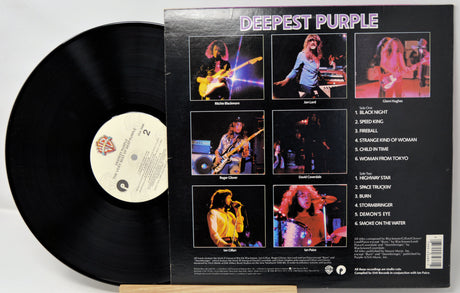 Vinyl record with a colorful album cover featuring band members and tracklist.
