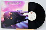 Vinyl record with 'Deepest Purple' album cover featuring a guitar and colorful design.