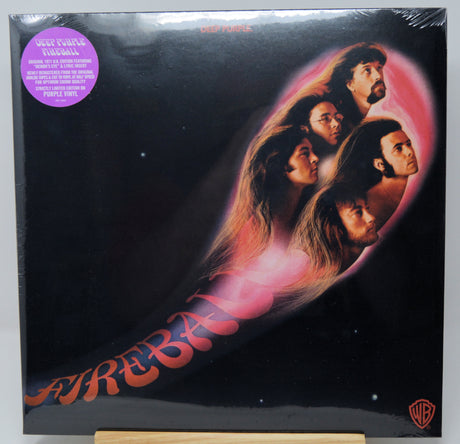 A vinyl record album cover for Deep Purple's 'Fireball' on a small wooden display stand. The cover is black with a large pink and red abstract shape containing stylized faces, with the band name 'DEEP PURPLE' at the top and the album title 'FIREBALL' in large red letters at the bottom.