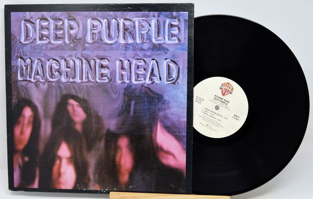 Deep Purple - Machine Head vinyl record shown with the album cover on the left and the black LP record partially pulled out on the right against a white background.