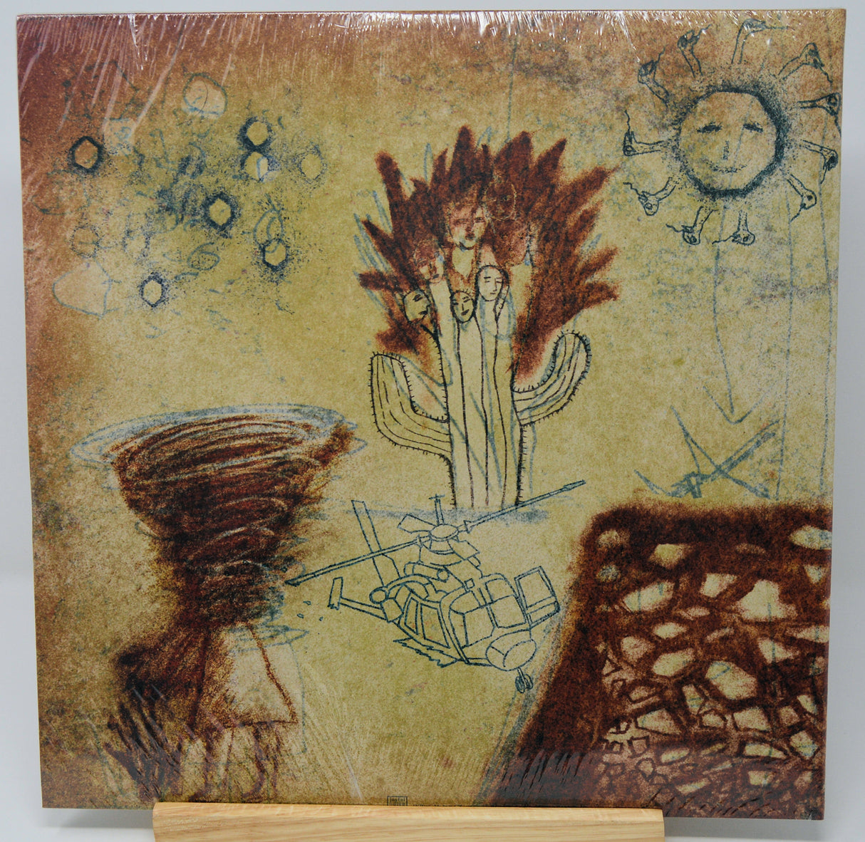 Artistic depiction of a cactus with abstract elements on a textured background
