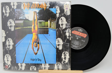 Vinyl record with cover titled 'High n' Dry' by Def Leppard on a white background